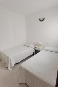 Postel nebo postele na pokoji v ubytování Casa María