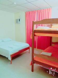 Postel nebo postele na pokoji v ubytování Hostal Montecarlos