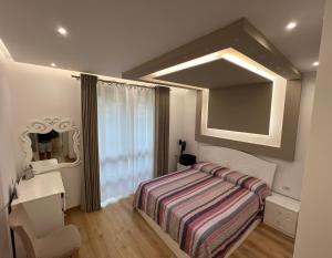 Ένα ή περισσότερα κρεβάτια σε δωμάτιο στο Gjiri i Lalzit, Durres - San Pietro - Alfred's Apartments with Garden