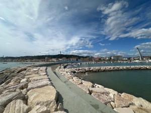 a walkway next to a body of water at House 130 Francavilla B&B in Francavilla al Mare