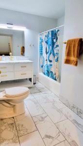 a bathroom with a toilet and a sink at Coastal Adventures, Lake, Ocean, Casinos, Hiking in Neotsu