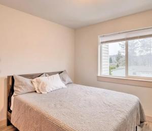 a bedroom with a bed and a window at Coastal Adventures, Lake, Ocean, Casinos, Hiking in Neotsu