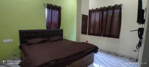 Voodi või voodid majutusasutuse Vaishno Mata homestay toas