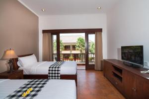Postel nebo postele na pokoji v ubytování Vidi Boutique Hotel