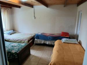 Ένα ή περισσότερα κρεβάτια σε δωμάτιο στο Quincho Los Abuelos