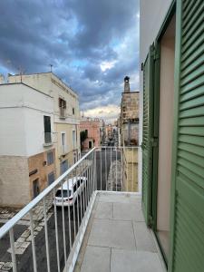a balcony with a view of a city at DIMORA Santa Lucia - LUXURY HOUSE in Monopoli