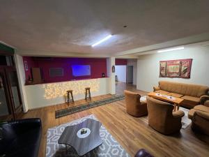 a living room with a couch and a table at Hostel 8 in Pristina