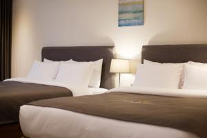 GnB Hotel tesisinde bir odada yatak veya yataklar