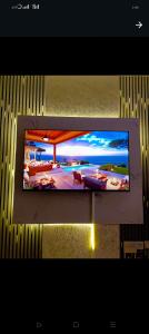 a flat screen tv hanging on a wall at 10 minutes to Karura forest Studios in thindigua Kiambu in Nairobi