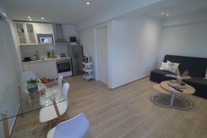 a living room with a couch and a table at Nikis Hοuse in Elia Laconias