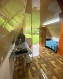 a room with a table and a bed in a tent at Cabaña Familiar in Río Cuarto