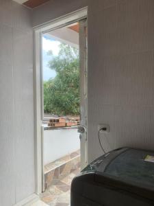 a window in a room with a car in front of it at Apartamento grande in Garzón