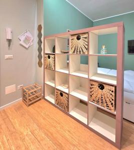 a room with a book shelf and a bed at Il Fico d'India in Bresso