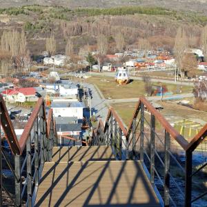 a view of a train station with a bridge at Cabaña Elizabeth in Cochrane