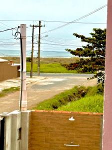 a view of the ocean from a building at Apartamento Ilha Comprida à beira-mar térreo in Ilha Comprida +7 photos