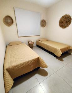 Postel nebo postele na pokoji v ubytování Riviera de São Lourenço