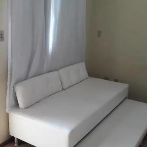 Ένα ή περισσότερα κρεβάτια σε δωμάτιο στο Aparthotel Praia do Pero