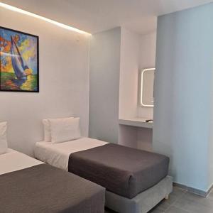 Postel nebo postele na pokoji v ubytování Petite Economy Lodge