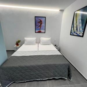 Postel nebo postele na pokoji v ubytování Petite Economy Lodge