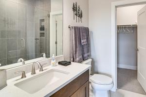 a bathroom with a sink and a toilet at Brand-New Townhome with Hot Tub, 4 Mi to Winter Park in Fraser +23 photos