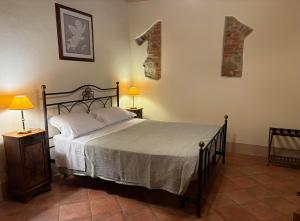 Ένα ή περισσότερα κρεβάτια σε δωμάτιο στο Casale delle Luci +43 φωτογραφίες