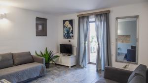 Μια τηλεόραση ή/και κέντρο ψυχαγωγίας στο Villa Romanza beach villa