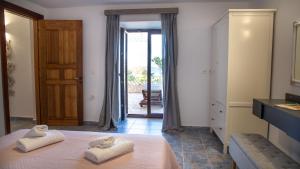 Ένα ή περισσότερα κρεβάτια σε δωμάτιο στο Villa Romanza beach villa