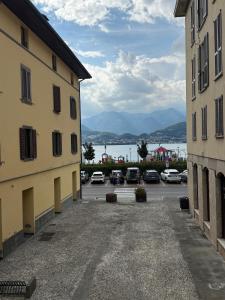 a view of a parking lot between two buildings at Casa GILDA in Pisogne