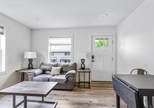 a living room with a couch and a table at 2BR Haven 306C Close to Charlottes Uptown in Charlotte