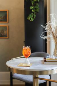 a wine glass sitting on top of a table at Heights House Hotel in Raleigh