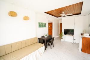 a living room with a couch and a table at MGM Tourist Inn in Tagbilaran City