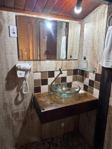 a bathroom with a sink and a mirror at Apartamentos Ouro Verde in Angra dos Reis +33 photos