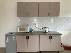 Η κουζίνα ή μικρή κουζίνα στο Un logement spacieux