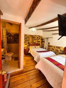 Кровать или кровати в номере Hotel Peru Ollantay