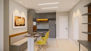 a kitchen with a dining table and yellow chairs at APARTAMENTO COP30 - Natureza e bem estar juntos in Ananindeua