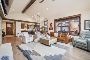 a living room with a couch and a table at Breck Mountain Getaway home in Overlook Athletic Club Heliport