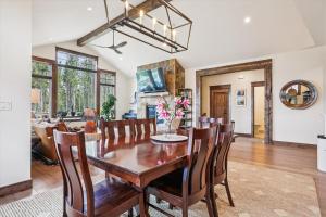 a dining room and living room with a table and chairs at Breck Mountain Getaway home in Overlook Athletic Club Heliport +46 photos
