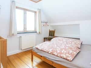En eller flere senge i et værelse på 8 person holiday home in Thyborøn-By Traum