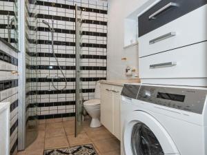 a laundry room with a washer and dryer at 4 person holiday home in Skærbæk-By Traum in Skærbæk +32 photos