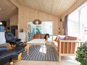 a living room with a couch and a table at Luxury Retreat in Klitmoller - By Traum Ferienwohnungen in Torsted