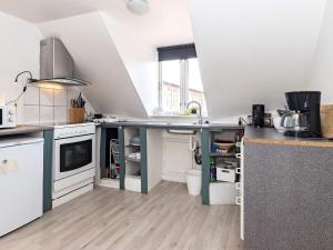 a kitchen with a sink and a counter top at 3 person holiday home in Ærøskøbing-By Traum in Ærøskøbing