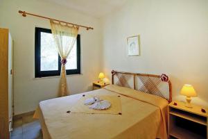 Ένα ή περισσότερα κρεβάτια σε δωμάτιο στο Apartment on Costa Rei near White Beaches