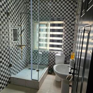 Koupelna v ubytování Oc apartments abuja + 11 fotografií