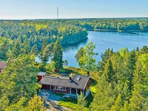 an aerial view of a house on the shore of a lake at 7 person holiday home in VÄRMDÖ-By Traum in Värmdö