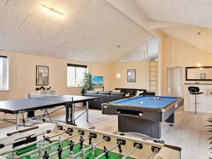 a room with ping pong tables and pool tables at 24 person holiday home in Hasselberg in Kappeln