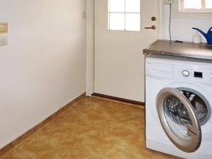 a laundry room with a washing machine in it at 6 person holiday home in STOCKARYD in Stockaryd