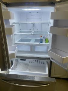 an open refrigerator with its door open and its at 22 min to Beach-2 bd room-Self check in -sleep 6-BBQ-WD in Pensacola +32 photos