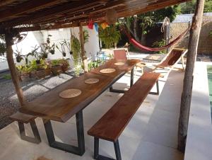 a long wooden table and chairs on a patio at Les Twins in Hinkong +49 photos