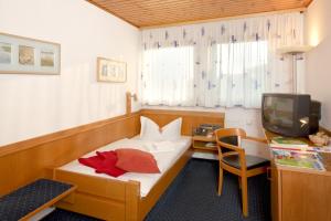 TV a/nebo společenská místnost v ubytování City Hotel Hanau