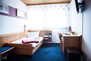 Postel nebo postele na pokoji v ubytování City Hotel Hanau